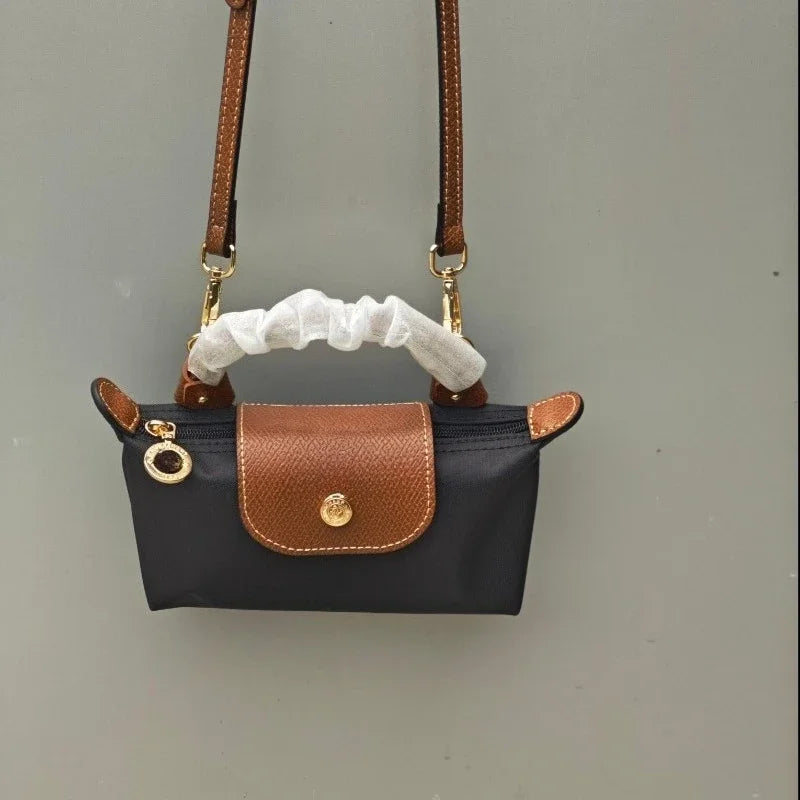 Mini moño de nailon para mujer, bolso de un solo hombro no perforado, multifuncional, para primavera y otoño